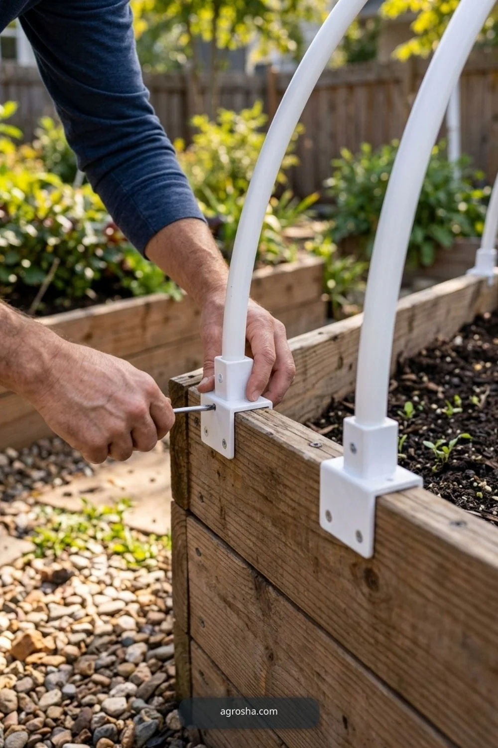 Install matching hoop anchors for DIY mini greenhouse for raised beds