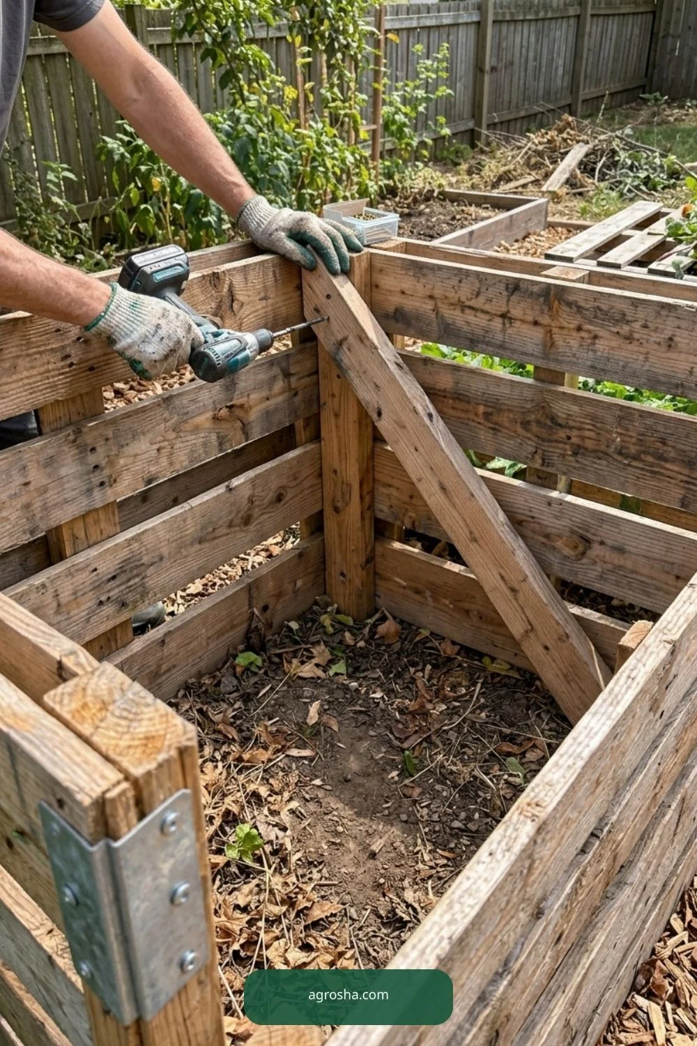 Brace empty bin first for DIY pallet compost bin