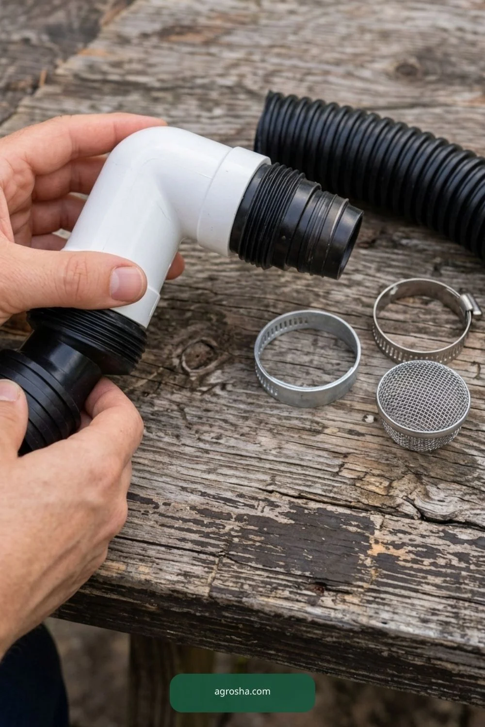 Hands checking PVC elbow and threaded bulkhead fitting for a barrel overflow outlet