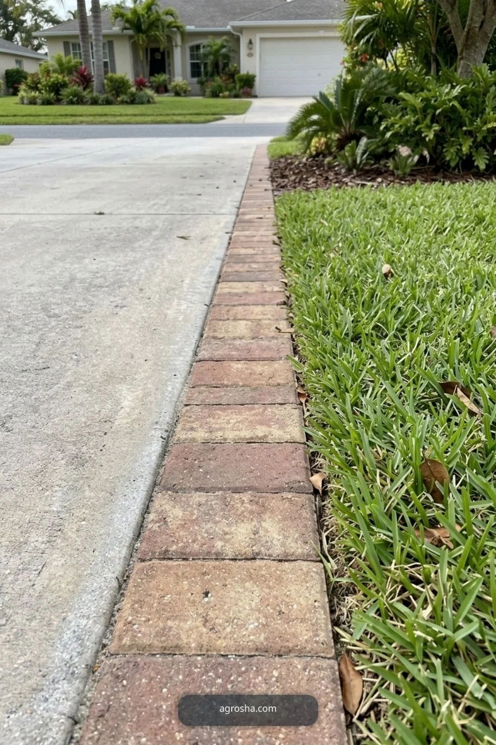 Florida driveway border showing flush brick mowing strip