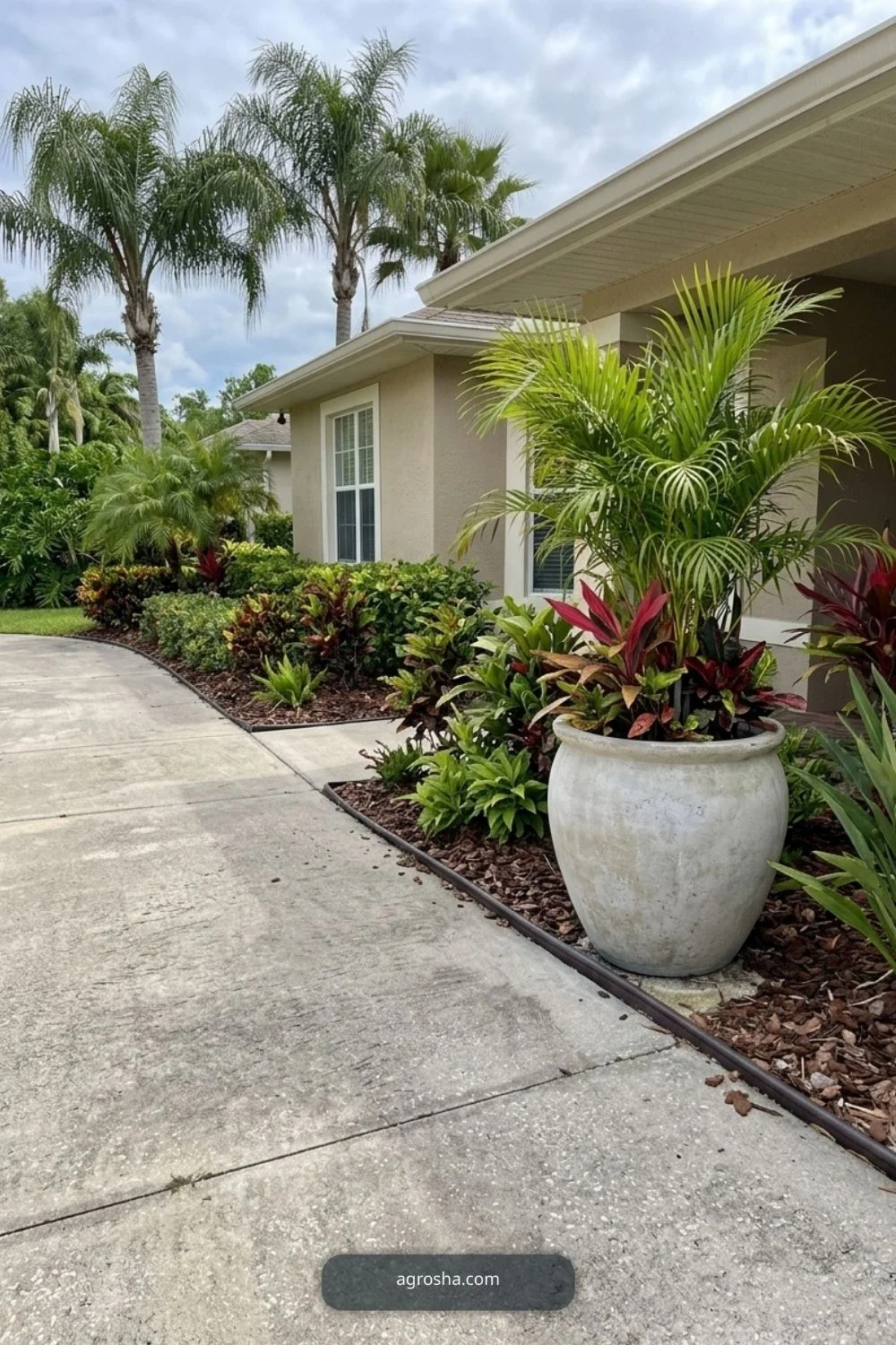 Florida driveway border showing one large planter near the house, not the street