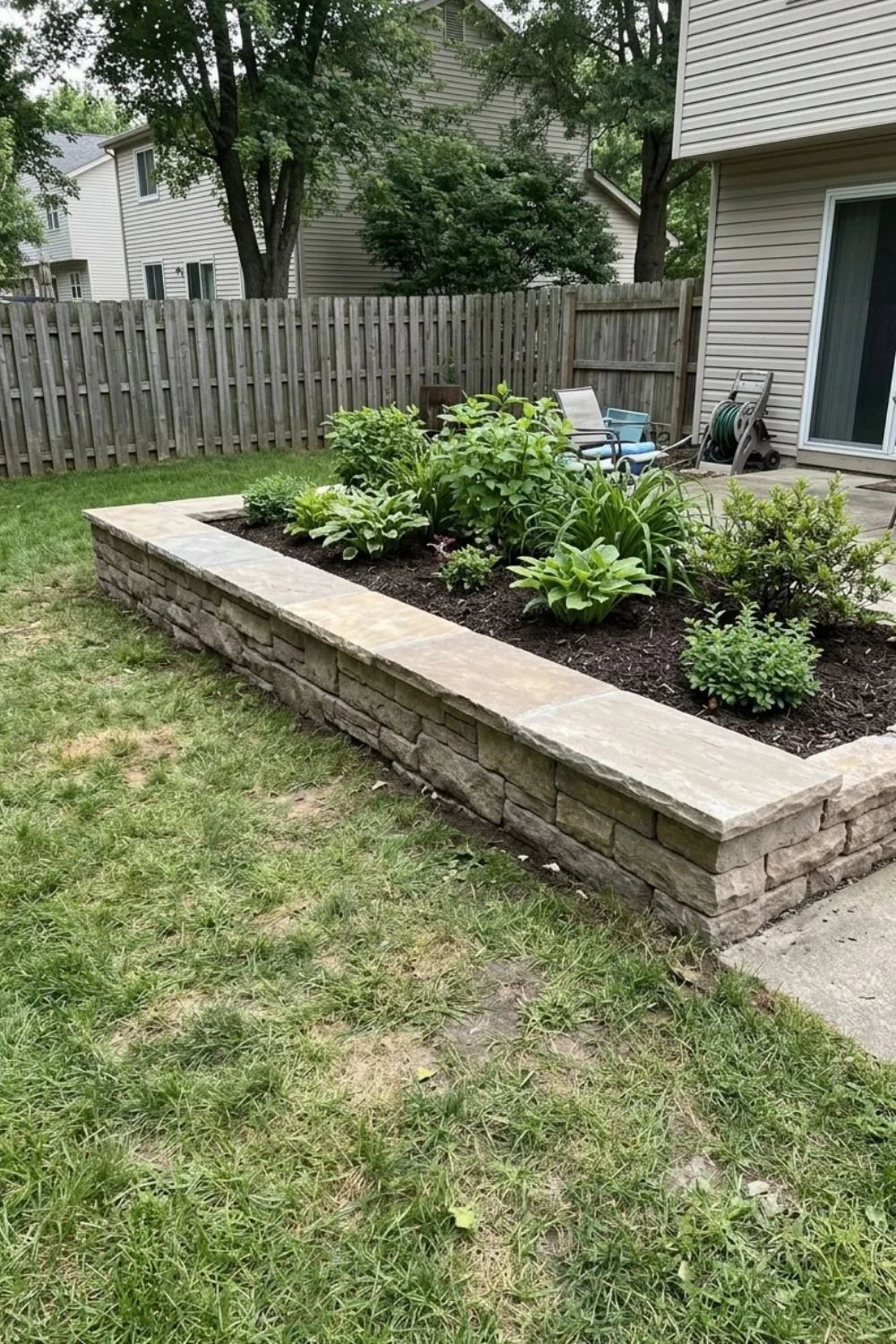 Border With Integrated Seating defining a flower bed in a suburban backyard