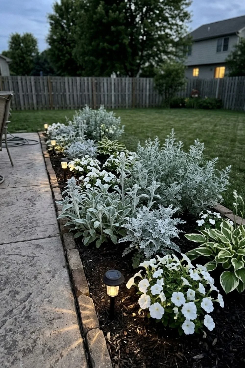 Moonlight White Border defining a flower bed in a suburban backyard
