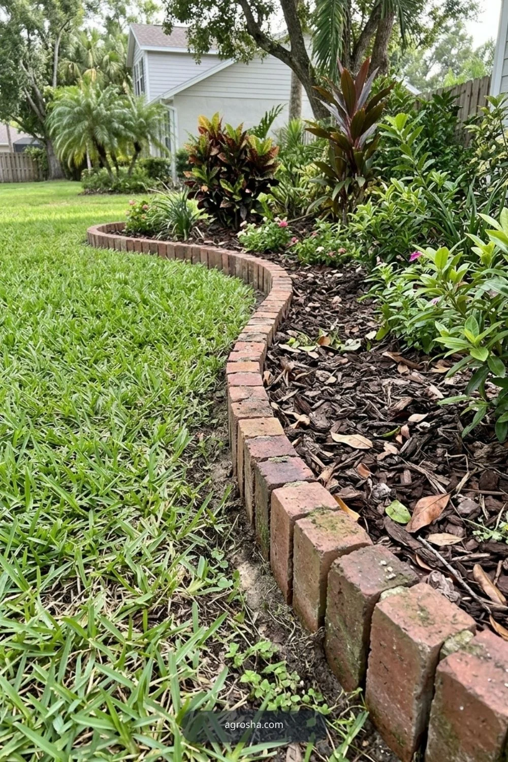 Florida landscape edging example showing upright brick border