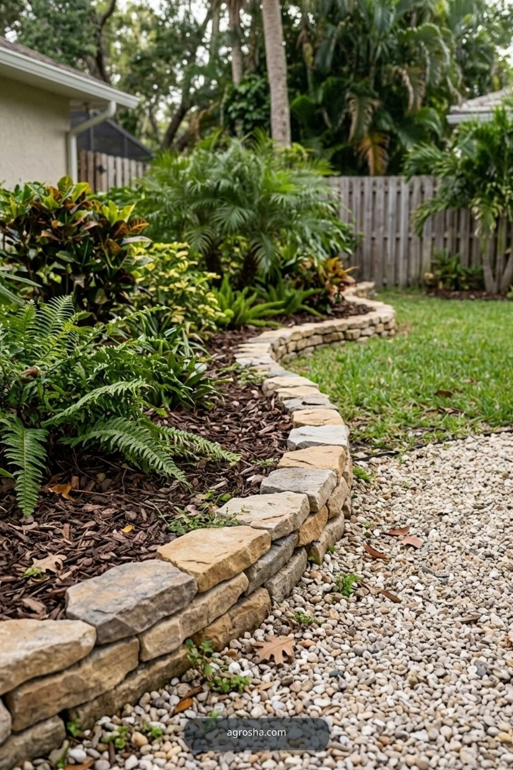 Florida landscape edging example showing low dry-stack stone edge