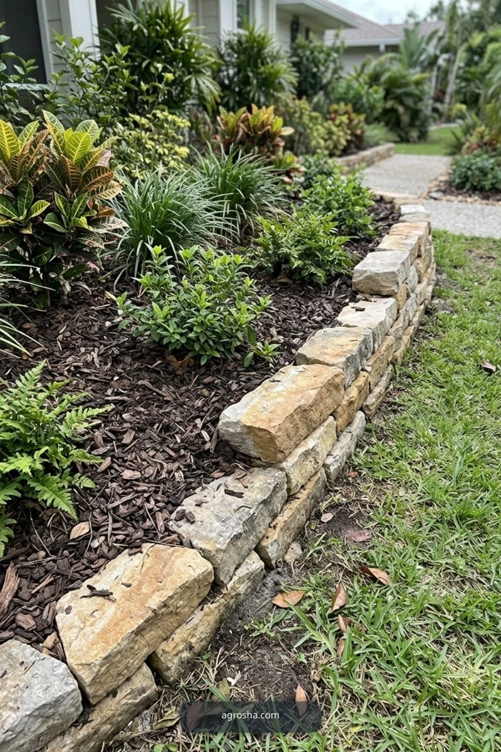 Florida landscape edging example showing stone edge on a gentle slope