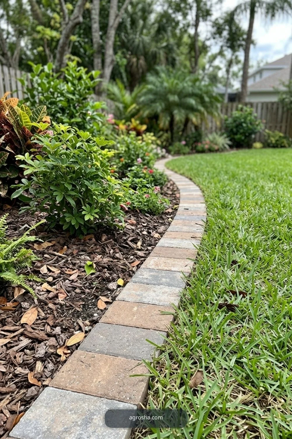 Florida landscape edging example showing flush paver edge beside lawn