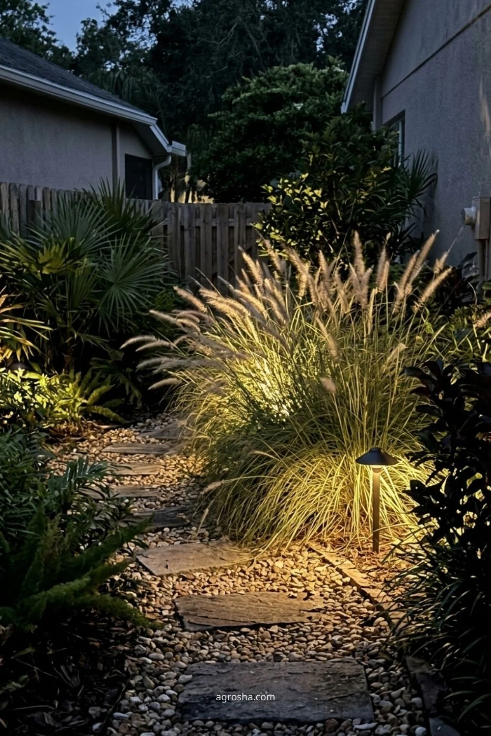 Florida garden lighting example showing soft light behind ornamental grasses