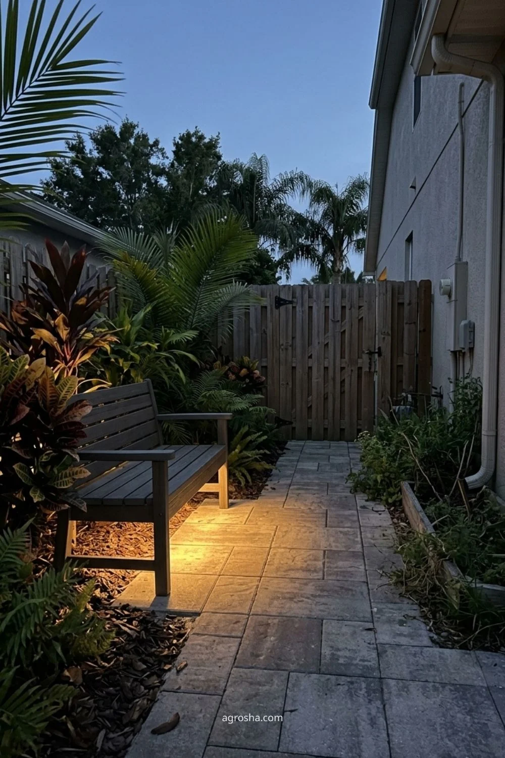 Florida garden lighting example showing warm under-bench lighting