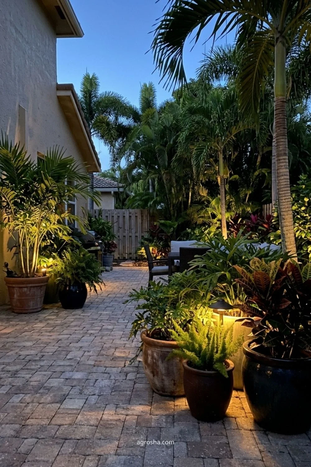 Florida garden lighting example showing planter accent lighting