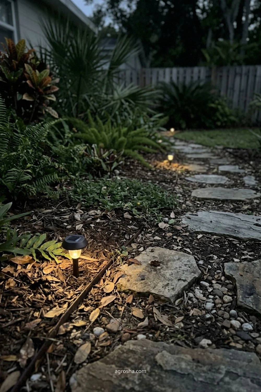 Florida garden lighting example showing solar marker lights for a low-traffic path