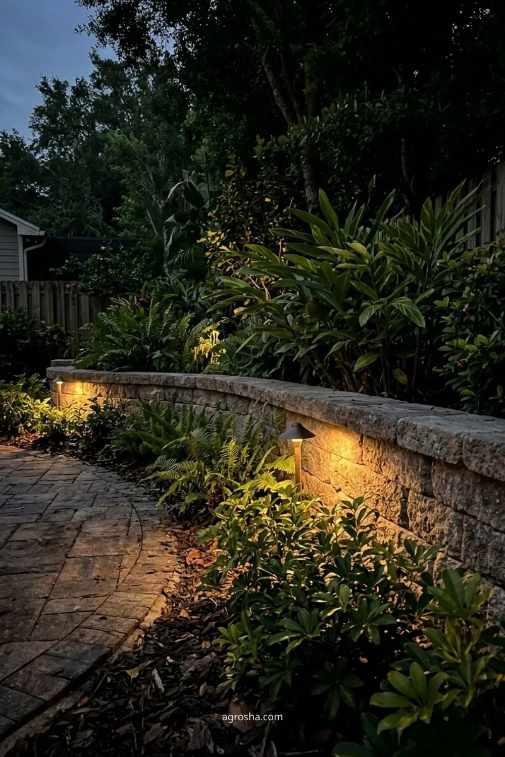 Florida garden lighting example showing soft light on a garden wall