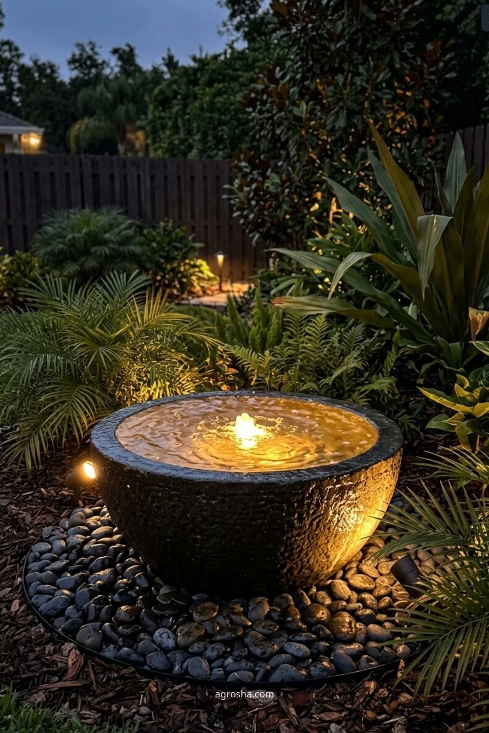 Florida garden lighting example showing water-bowl accent light