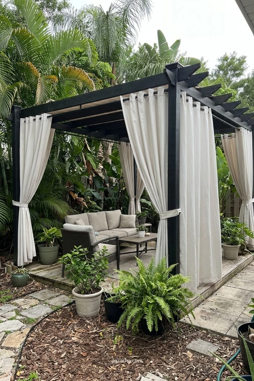 Florida privacy screen example showing outdoor curtains under a pergola