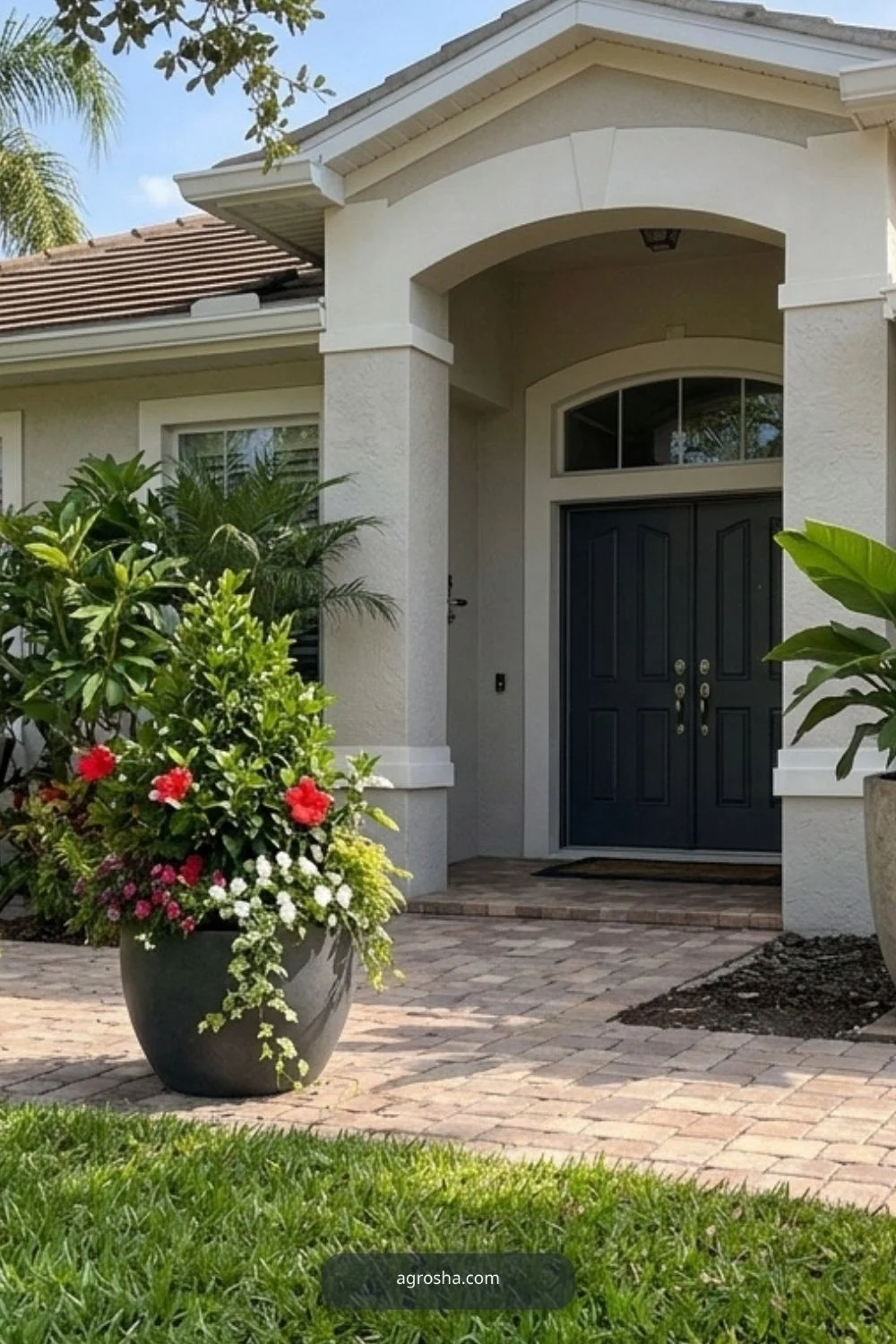 Large outdoor planters at a Florida home entry and patio