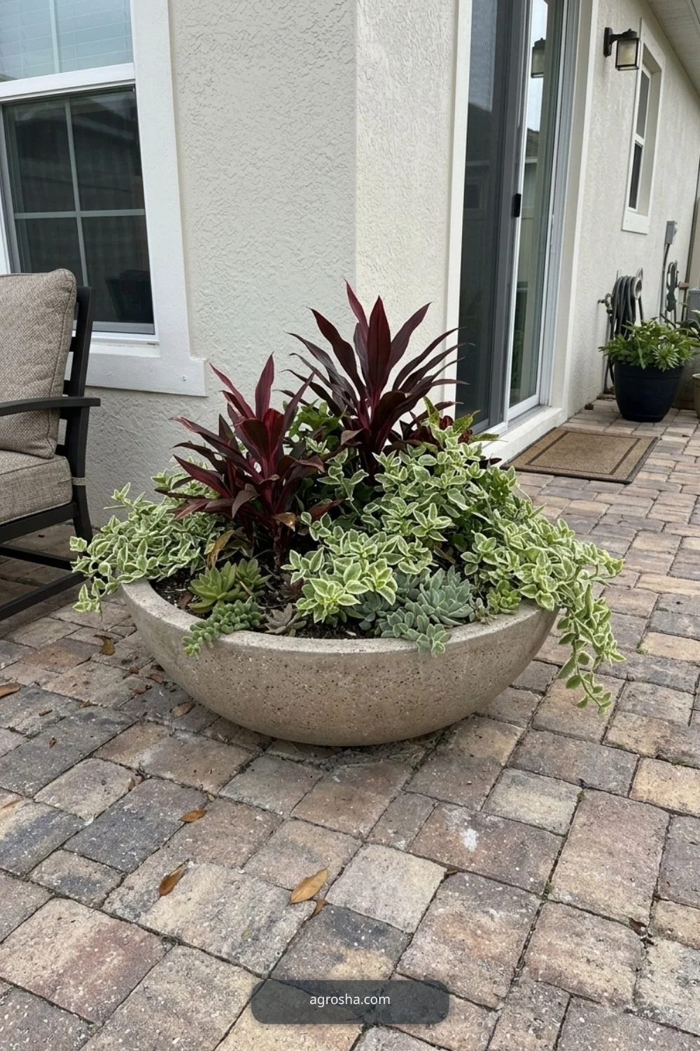 Florida outdoor planter example showing low wide bowl on a patio corner