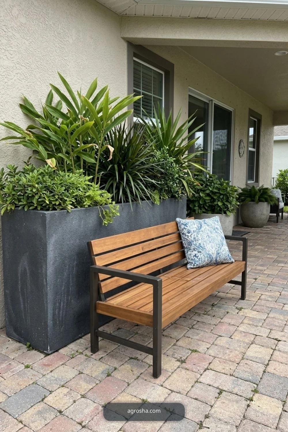 Florida outdoor planter example showing large planter behind a bench